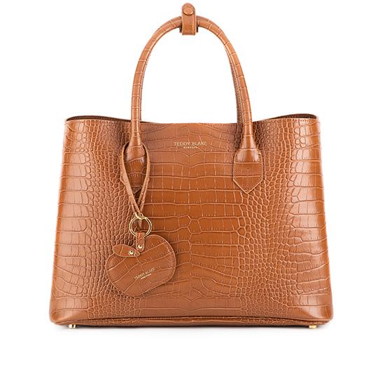 Teddy Blake - The Vanessa is a luxurious tote handbag perfect for travel.  👜 Handcrafted in Italy with premium leather and design details, you'll  always be stylish even on your most hectic